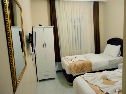 Postel nebo postele na pokoji v ubytování Tolga Hotel