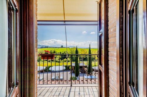 an open door to a balcony with a view of a garden at B&B A casa di Giulia in Guidonia