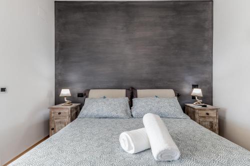 a bedroom with a bed with two pillows on it at B&B A casa di Giulia in Guidonia