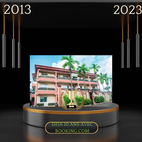 a display with a picture of a building at Résidence Hotelière Borel Denver in Douala