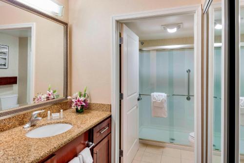 a bathroom with a sink and a shower at Residence Inn by Marriott Auburn in Auburn