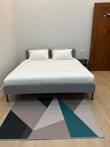 Postel nebo postele na pokoji v ubytování Cendhani Raras Gallery