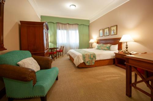 Ένα ή περισσότερα κρεβάτια σε δωμάτιο στο Granados Park Hotel