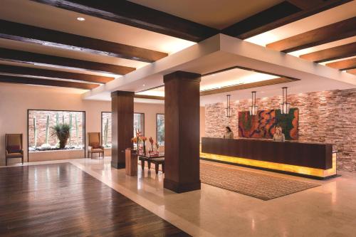 a lobby of a building with a brick wall at The Ritz-Carlton, Rancho Mirage in Rancho Mirage