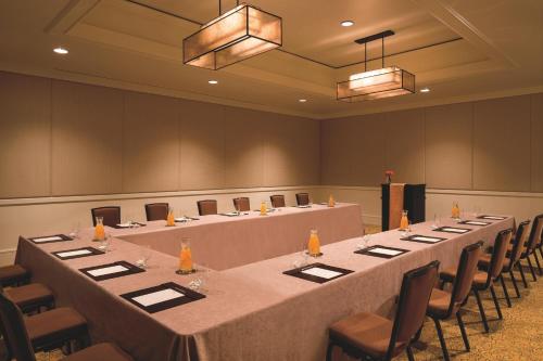 a conference room with a long table and chairs at The Ritz-Carlton, Rancho Mirage in Rancho Mirage