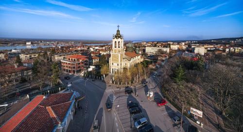 an aerial view of a city with a clock tower at Пансион - Димитър Хадживасилев in Svishtov
