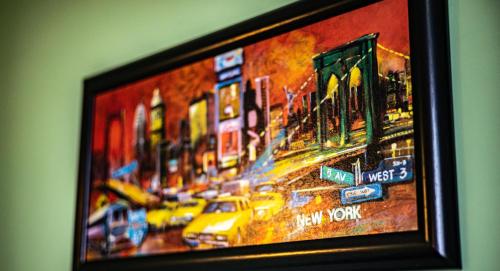 a painting of a city street with cars at Пансион - Димитър Хадживасилев in Svishtov