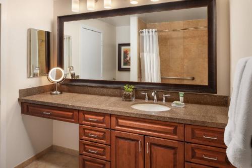 a bathroom with a sink and a large mirror at Marriott's StreamSide Douglas at Vail in Vail