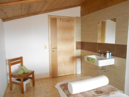 a bathroom with a sink and a mirror at Haus Unterdieterer in Annaberg im Lammertal