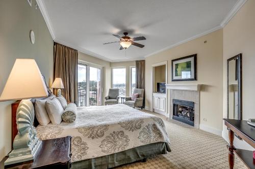 a large bedroom with a bed and a fireplace at Marina Inn Grande Dunes Unit 7-301A in Myrtle Beach