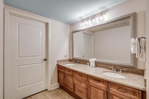 a bathroom with a sink and a mirror at Marina Inn Grande Dunes Unit 7-301A in Myrtle Beach