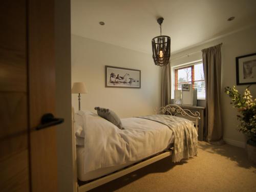 a bedroom with a bed and a window at Brookwood in Pickering