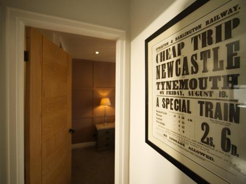 a poster of a movie hanging on a wall in a room at Brookwood in Pickering