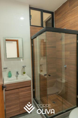 a bathroom with a shower and a sink at Torre Oliva in Mazatlán