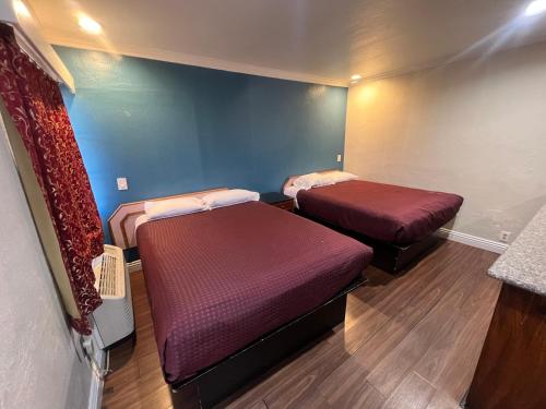 Postel nebo postele na pokoji v ubytování Harris Motel