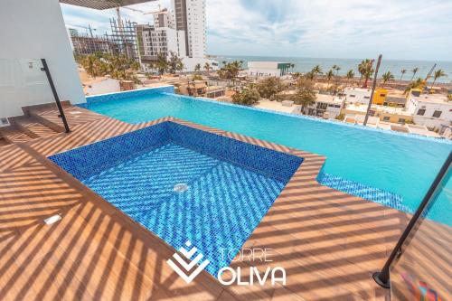 a swimming pool on the roof of a building at Torre Oliva in Mazatlán