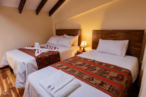 A bed or beds in a room at Quechua Hostal Recoleta