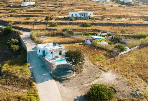 an aerial view of a house in a field at Santa Marina Syros in Liaropá
