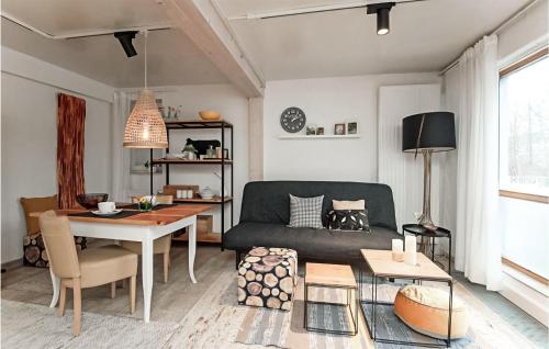 a living room with a couch and a table at 1 Bedroom Gorgeous Apartment In Suhl in Suhl