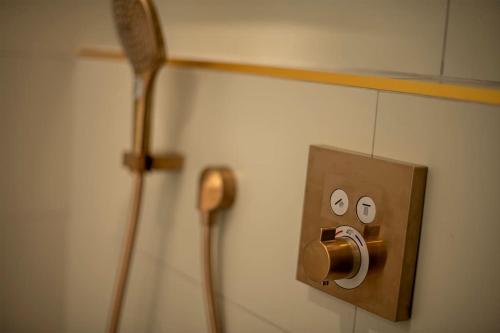 a electrical outlet with two eyes on a wall at Loft/Jacuzzi L'instant in Saint-Valéry-en-Caux