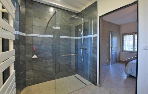 a shower with a glass door in a bathroom at 4 Bedroom Cozy Home In Montsenelle in Lithaire