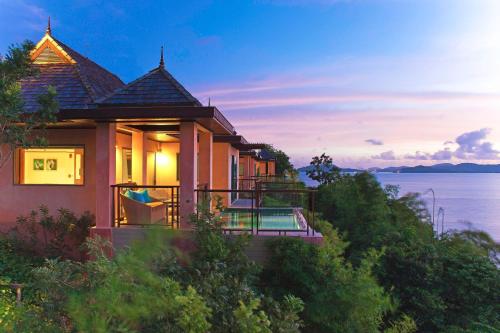 a house on a hill with a view of the ocean at The Westin Siray Bay Resort & Spa, Phuket in Phuket Town