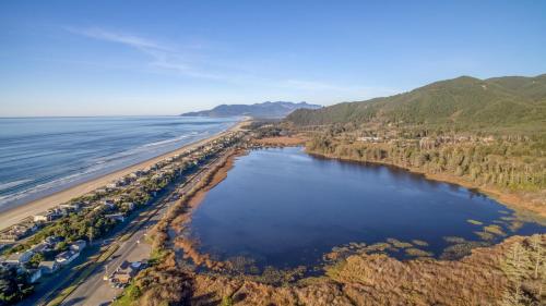 an aerial view of the beach and water at Seabatical on The Strand - Meredith Lodging in Rockaway Beach