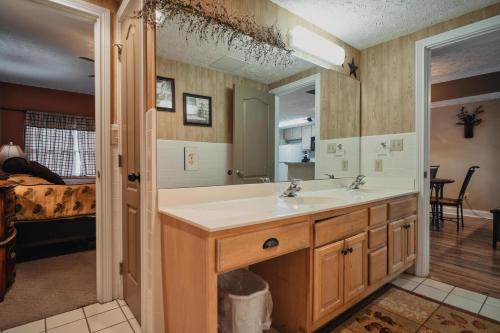 a bathroom with a sink and a mirror at Gv - Unit 1502 - Happy Time Bear in Pigeon Forge