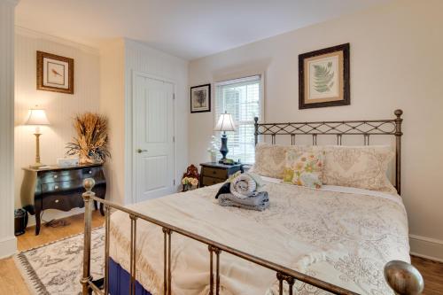 a bedroom with a large bed and a piano at 7 Mi to The Biltmore Le Canard Cottage with Porch in Arden