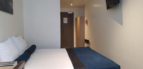Postel nebo postele na pokoji v ubytování Hotel Library Amsterdam
