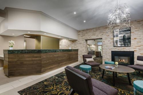 a lobby of a hotel with a fireplace at Residence Inn by Marriott Gaithersburg Washingtonian Center in Gaithersburg