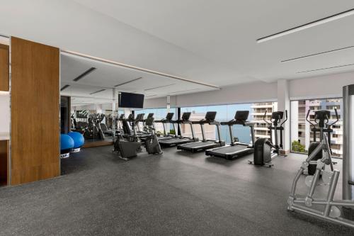 a gym with treadmills and elliptical machines at Courtyard by Marriott North Pattaya in Pattaya North