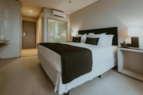 Un ou plusieurs lits dans un hébergement de l'établissement LS Hotel