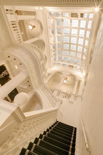 a stairway with a black and white staircase at Hotel Granvia in Barcelona