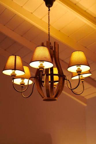 a chandelier hanging from a ceiling at LE JARDIN DU FORT - GALLE in Galle