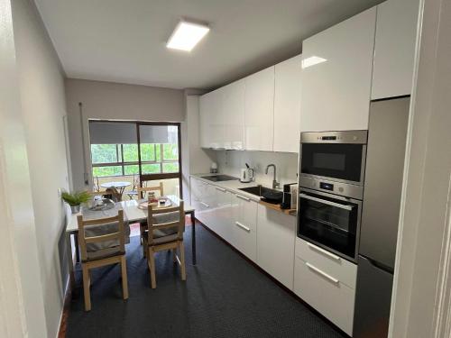 Η κουζίνα ή μικρή κουζίνα στο Olympic Apartment
