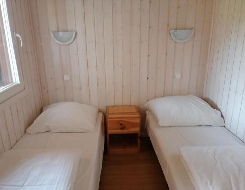 เตียงในห้องที่ Ferienhaus in Dziwnw mit Terrasse, Garten und Grill