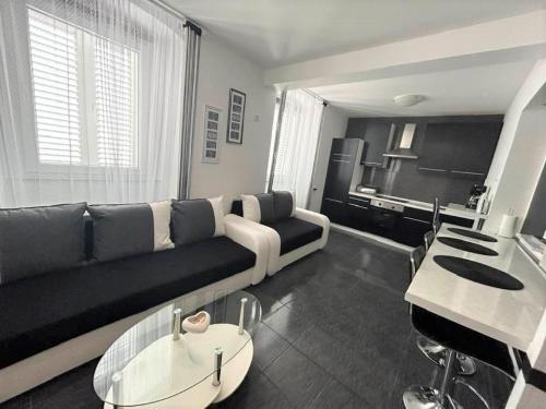 a living room with a couch and a piano at Apartment Decumana in Krk