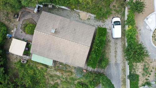 an overhead view of a building with a car parked next to it at PILOUBELLE 