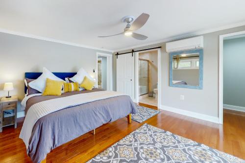 a bedroom with a bed and a ceiling fan at Valentine Creek Retreat in Odenton