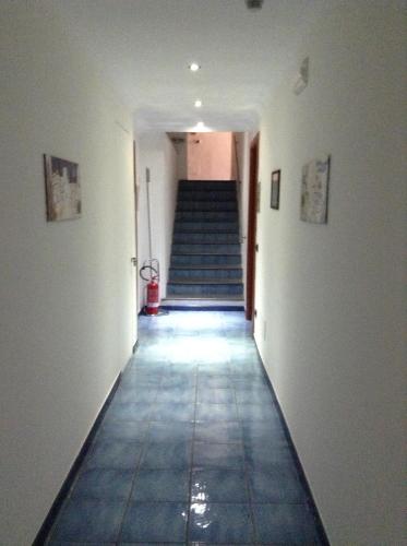 a hallway with a staircase in a building at Hotel Floridiana in Amalfi