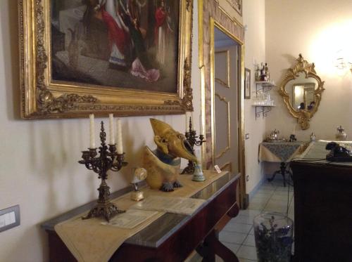 a bathroom with a sink and a painting on the wall at Hotel Floridiana in Amalfi