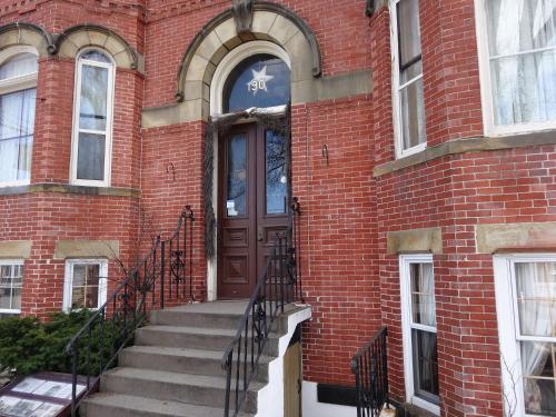 a brick building with stairs leading to a door at A Tanners Home Inn Bed and Breakfast in Saint John