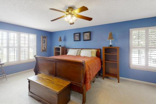 a bedroom with a bed and a ceiling fan at The Home on Tyson Lake Drive in Jacksonville