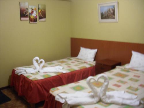 two beds in a room with hearts on them at Casa de Isabel in Arequipa