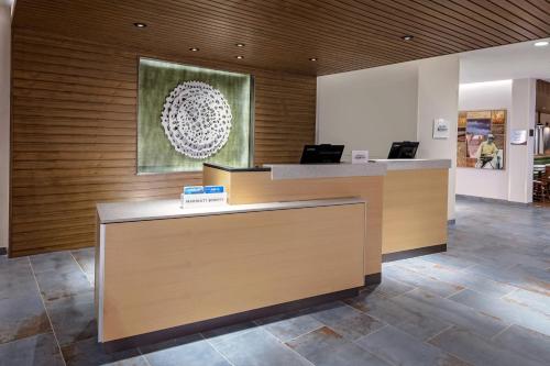 an office lobby with a reception desk with two laptops at Fairfield by Marriott Port Clinton Waterfront in Port Clinton