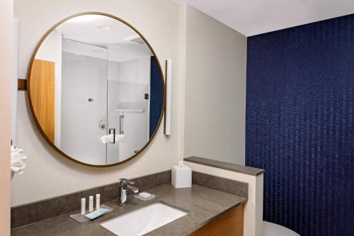 a bathroom with a sink and a mirror at Fairfield by Marriott Port Clinton Waterfront in Port Clinton