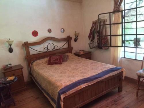 En eller flere senge i et værelse på La Escondida - Casa Quinta en los Cardales