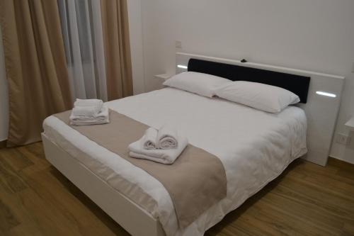 מיטה או מיטות בחדר ב-Nel Cuore del Borgo "Superior"