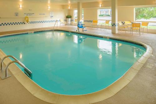 a large pool with blue water in a hospital at Fairfield Inn Joplin in Joplin